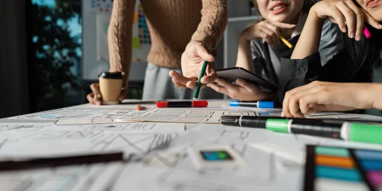 People reviewing a design and project plan together